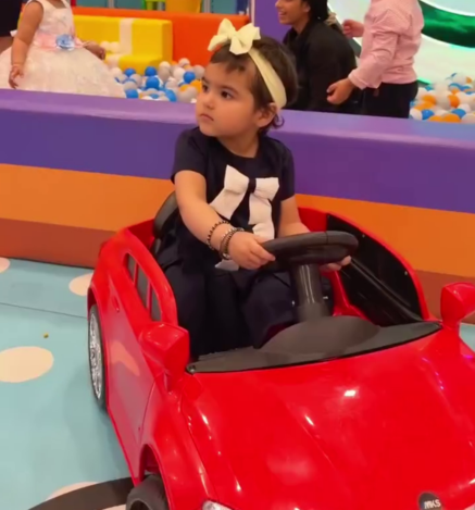 Child enjoying a fun car ride at Wooray Dehradun