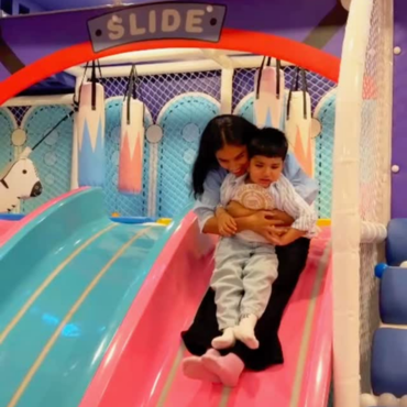 Children enjoying a colourful slide at Wooray