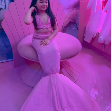 Girl enjoying a mermaid-themed experience at Wooray