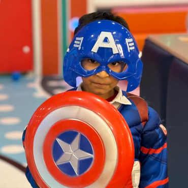 Child dressed as a superhero at Wooray